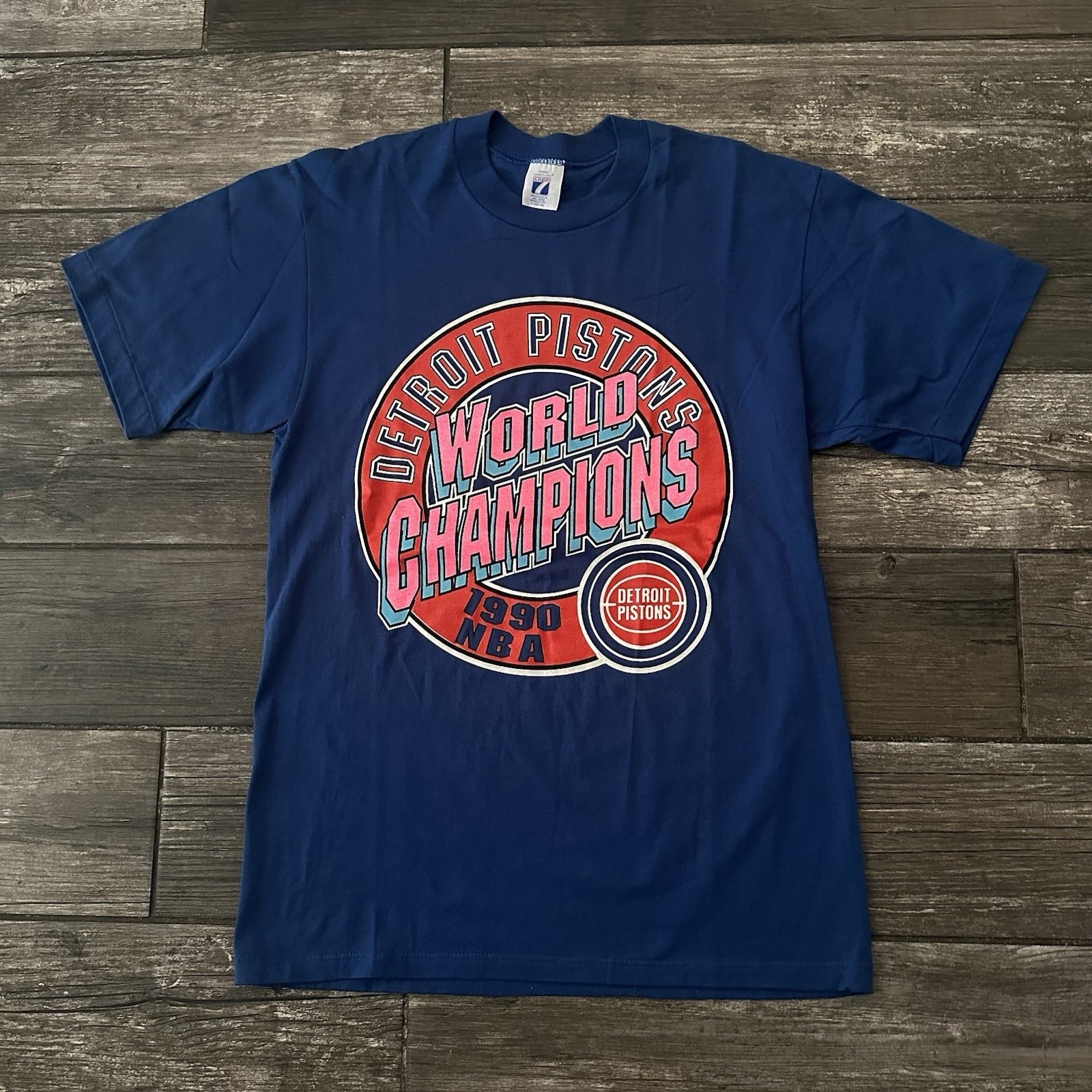 VTG 80s LOGO 7 DETORIT PISTONS BASKETBALL NBA WORLD CHAMPIONS BLUE T-SHIRT SZ L Yesterday's Fits Clothing Fashion Vintage Streetwear Fashion Item