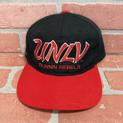 VTG SPORTS SPECIALTIES UNLV RUNNIN REBELS SCRIPT SNAPBACK RED BLACK DOME ADJUST Yesterday's Fits Clothing Fashion Vintage Streetwear Fashion Item